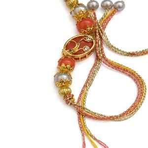 Orange Stone Beaded With Kundan Oval Rakhi 